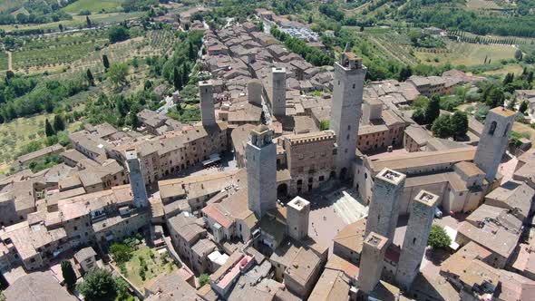 Flying over San Gimignano hill town in Tuscany, Italy, Europe alt