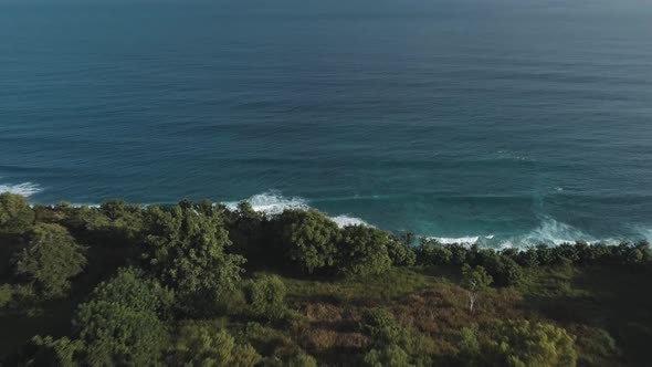 Aerial View of Tropical Beach with Azure Blue Water and Foaming Ocean Waves alt