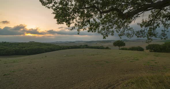 Timelapse View of a Rural Landscape During Sunset in Tuscany. Rural Farm, Cypress Trees, Green