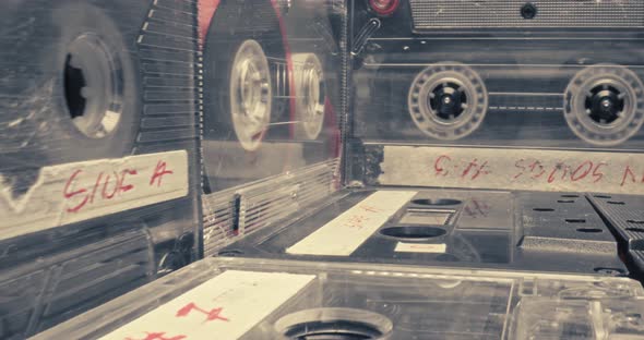 Player with spinning audio cassette. Cassette and player. Parallax effect. alt