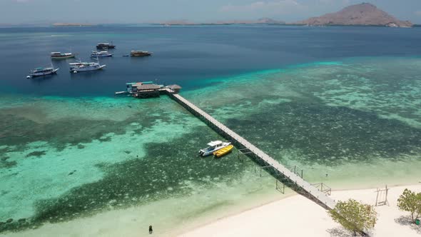 Drone Over Long Pier With Tourist Boat alt