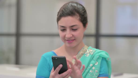 Portrait of Indian Woman Using Smartphone alt