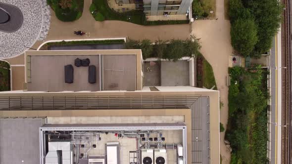 View From a Drone on the Roof of Multistorey Buildings Surrounded By Trees