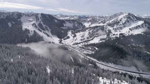 Aerial Flyback At Stevens Pass Ski Resort With Cascade Mountain Range In Background alt