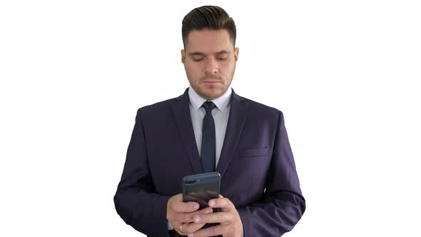 Serious Businessman Texting Message on His Phone on White Background alt