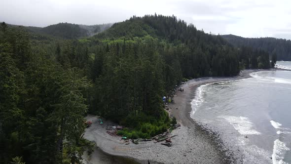 Drone approaching vast temperate rainforest that covers the wild and untouched west coast of Vancouv alt