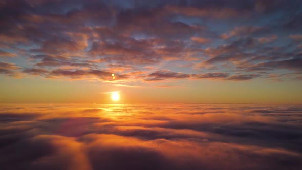 Aerial footage of setting sun up in the sky