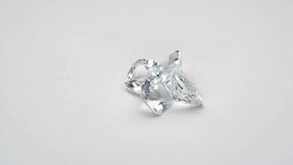 Natural Cushione Cut White Topaz Gemstones on the White Turning Table