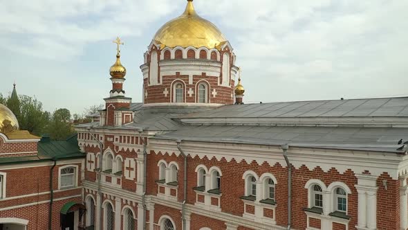 Facade of Church with Golden Dome in City