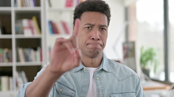 No, Young African American Man Disapproving By Finger Sign  alt