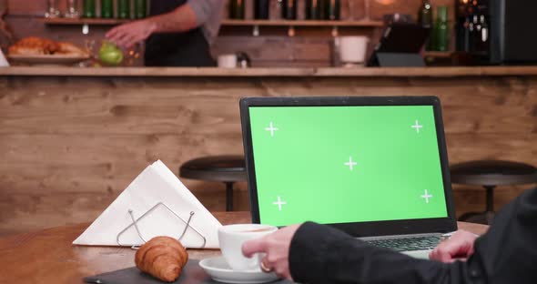 Green Screen Computer in Stylish and Vintage Coffee Shop alt