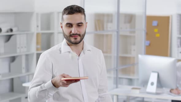 20-something Male Employee Practicing Ping-Pong alt