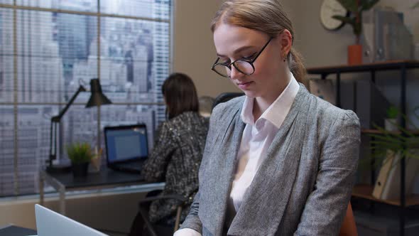 Concentrated Business Woman Using Laptop Sits at Office Desk Workplace Web Designer Online Work alt