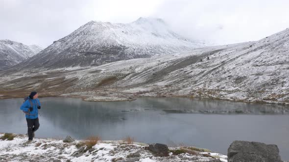 A Middle Aged Man Leads an Active Life. He Travels the Mountain Route Alone and with a Backpack. alt