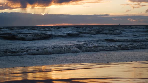 waves on the beach at sunset