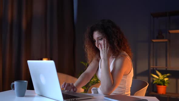 Portrait of a Businesswoman Working Late at Night at Home Office alt