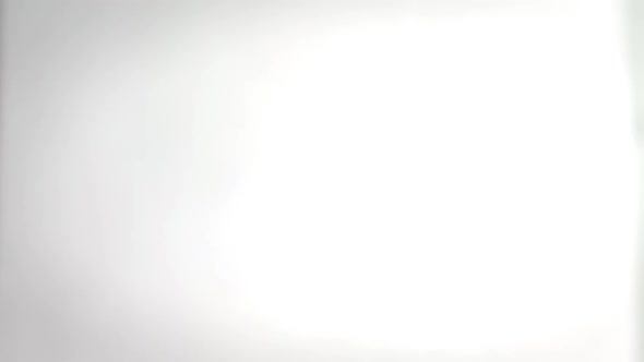 Essential Oils in Dark Glass Bottle with Aroma Herbs and Fresh Leaves of Basil and Rosemary alt