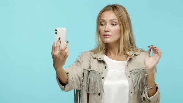 Slow Motion of Beautiful Blond Woman Taking Selfie Looking at Herself on Mobile Phone and Dancing