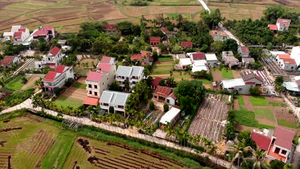 Rural farmers houses and rice paddy fields in Da Nang Vietnam, rising ...