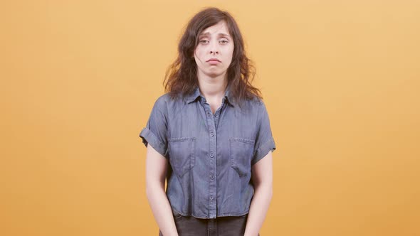 Portrait of a Sad Young Woman Looking Guilty alt