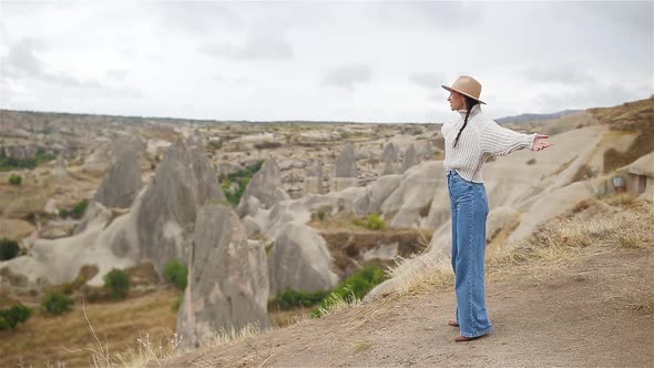 Young Woman on the Edge of Canyon in Cappodocia