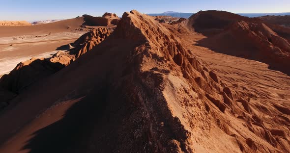 Aerial Drone Footage Over the Ridge of a Sandy Hill in the Most Arid Atacama Desert. alt