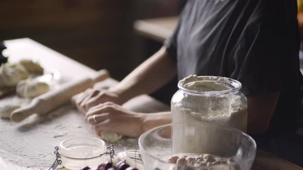 Young Woman in Grey Tshirt Hands Prepare Dough