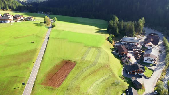Aerial footage of A beautiful Alps Green Valley during Fall Season