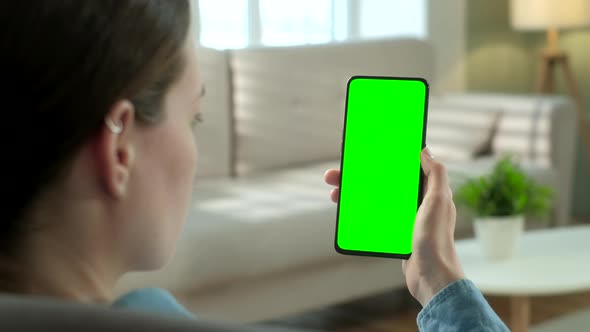 POV View of Woman at Phone with Green Screen for Copy Space. Chromakey Mock Up Without Tracking alt