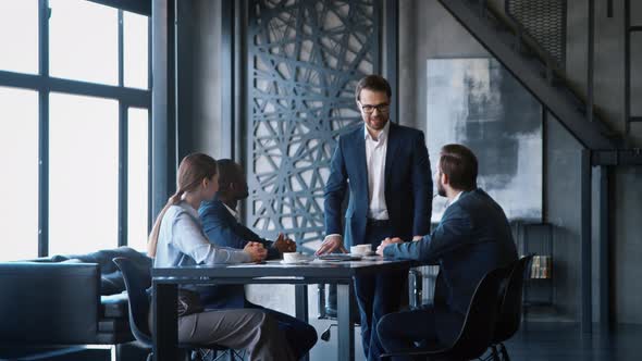 Business people applauding and cheering corporate leader after successful presentation alt