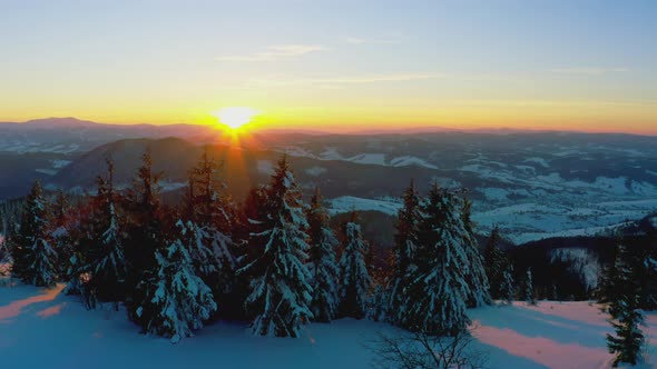 An Extraordinary Valley with Hills and Mountains Covered with Fir Forests Against the Backdrop of a alt