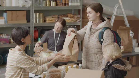 Volunteers Giving Humanitarian Help to Refugees alt