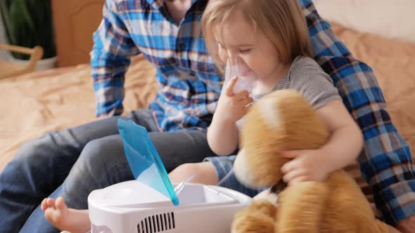 Father Helps His Daughter Use Nebulizer Sick Child Asthma Bronchitis Lung Disease