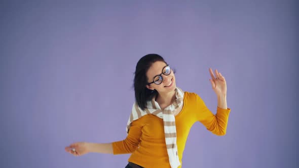 Slow Motion of Female Hipster Jumping Moving Head Waving Black Hair Having Fun alt