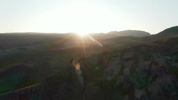 Aerial View Backlight of Rocky Panoramic Landscape of Countryside in Iceland alt