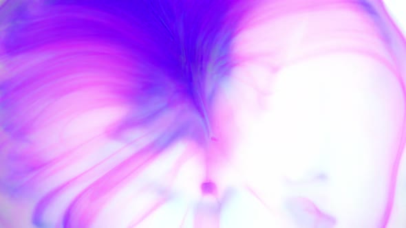 Ink in Water. Purple Ink Reacting in Water Creating Abstract Background. alt