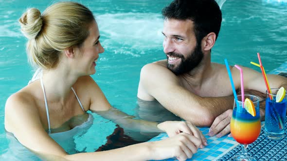 Picture of Happy Couple Relaxing in Pool