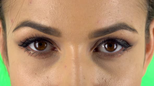 Brown Female Eyes Looking Straight and Smiling alt