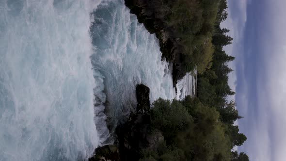 Vertical shot of water gushing through famous Huka falls, Taupo, New Zealand alt