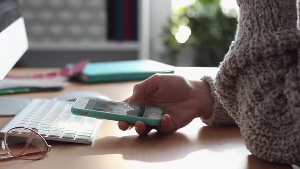 Young Woman Procrastinates Scrolling her Smartphone alt