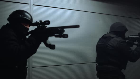 Special Ops Team Looking Through Scopes on Rifles alt