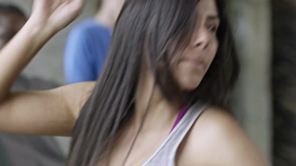 Young Woman Dancing in Group Class alt