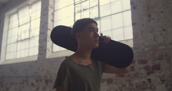 Fashionable young man in an abandoned warehouse alt
