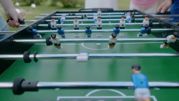 Closeup of Two Person Playing Table Football