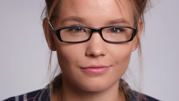 Closeup portrait of young woman on white background