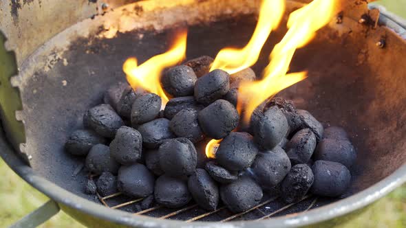 Closeup Of Glowing Coal In Metal Grill On Summer Day alt