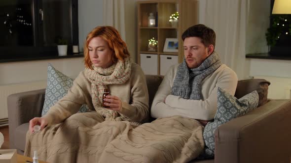 Sick Couple with Medicine or Antipyretic Syrup alt