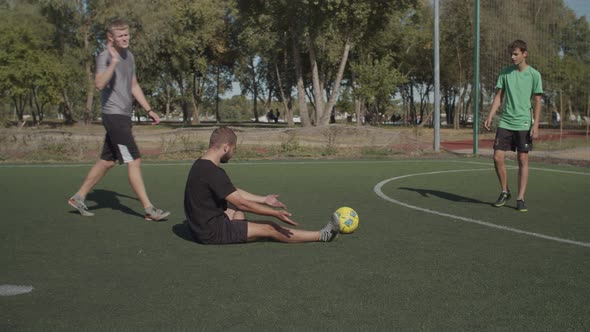 Soccer Player Helps Teammate To Get Up After Foul alt