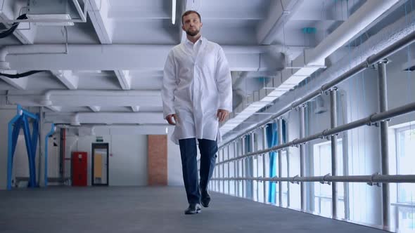 Young Worker Walks on Laboratory alt