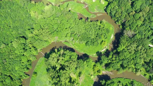 Aerial view of a river flowing through a beautiful landscape  alt